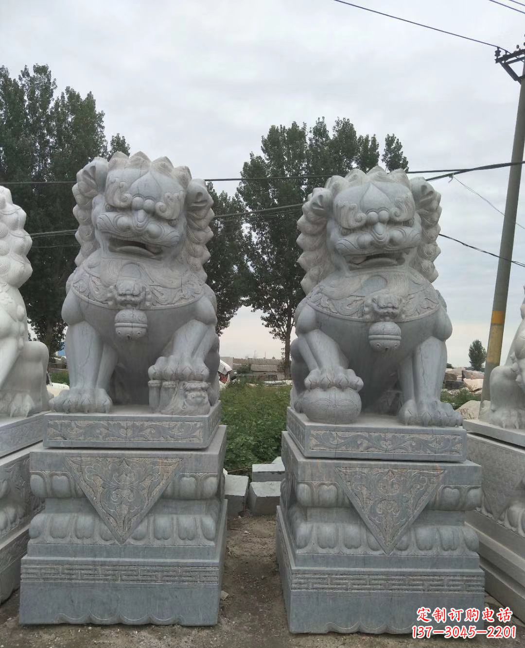 长春青石狮子象征力量的传统精灵
